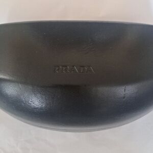 Stylish Authentic Prada SPR 57L Sunglasses. Black and Grey tones